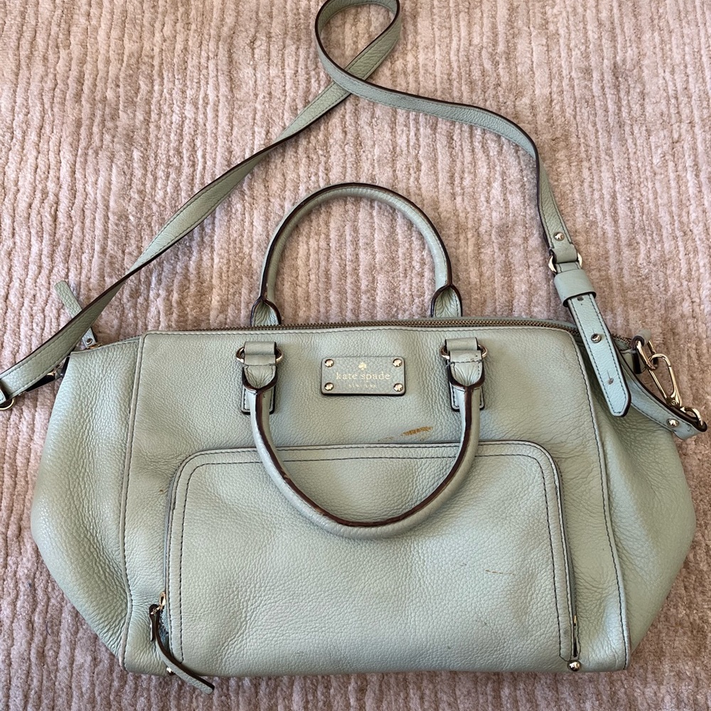 Needs cleaning. Kate spade tote bag. Shaped like a duffel. Mint green leather.